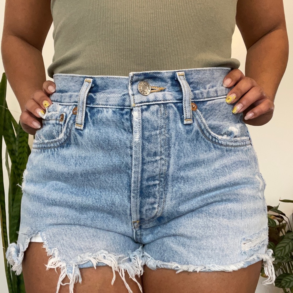 Brand Agolde. Light Was Jean Shorts with rip hem.